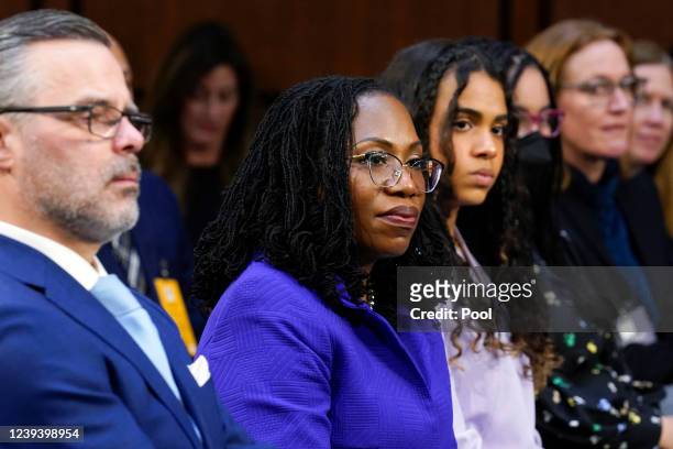 Supreme Court nominee Ketanji Brown Jackson, second from left, sits with her husband Dr. Patrick Jackson, left, and daughters Leila Jackson, third...