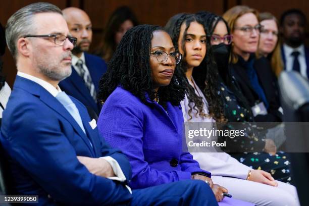 Supreme Court nominee Ketanji Brown Jackson, second from left, sits with her husband Dr. Patrick Jackson, left, and daughters Leila Jackson, third...