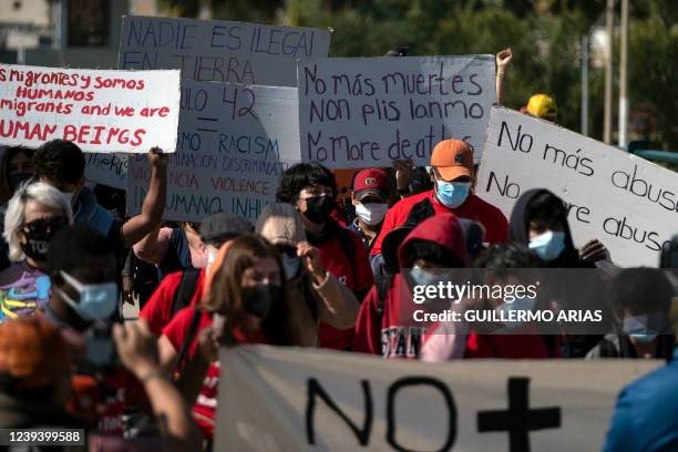 Migrants and asylum seekers march to protest against Title 42 policy heading to the Mexican side of the San Ysidro Crossing port in Tijuana, Baja...