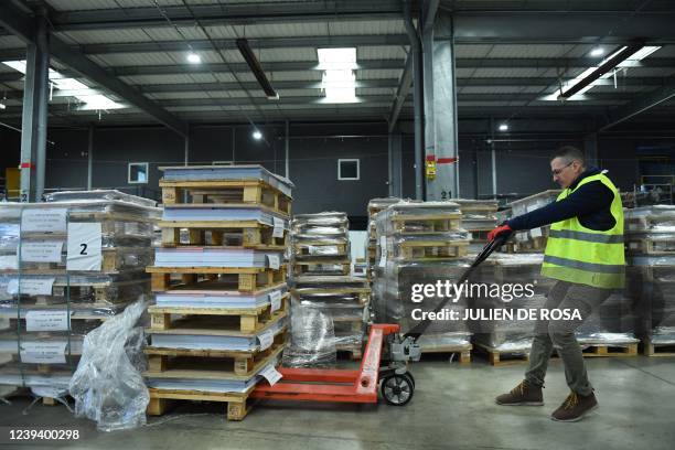 Employees prepare official campaign posters of French presidential election candidats at France Affichage Plus, the logistical center where thousands...