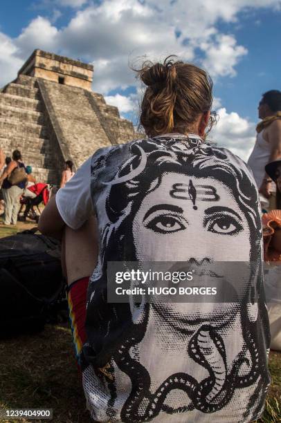 People surround the Kukulcan Pyramid at the Mayan archaeological site of Chichen Itza in Yucatan State, Mexico, during the celebration of the spring...