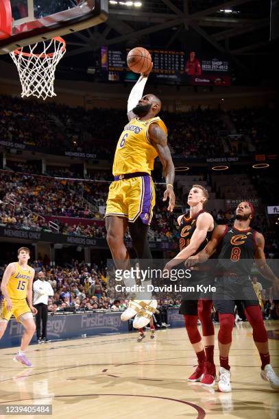 LeBron James of the Los Angeles Lakers dunks the ball during the game against the Cleveland Cavaliers on March 21, 2022 at Rocket Mortgage FieldHouse...