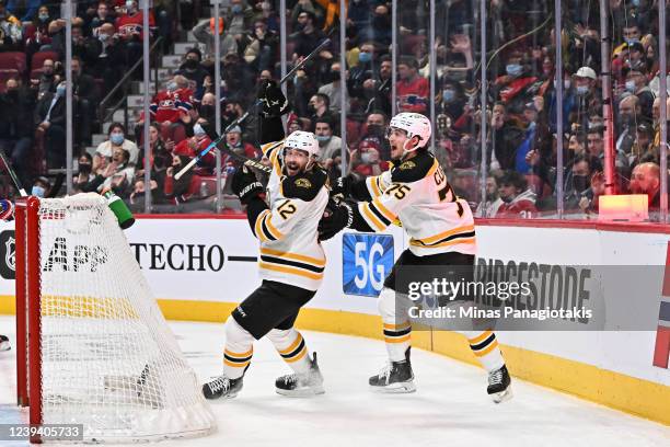 Connor Clifton of the Boston Bruins celebrates his goal with teammate Craig Smith during the third period against the Montreal Canadiens at Centre...