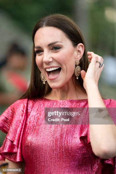 Catherine, Duchess of Cambridge speaks with guests during a special reception hosted by the Governor General of Belize in celebration of Her Majesty...