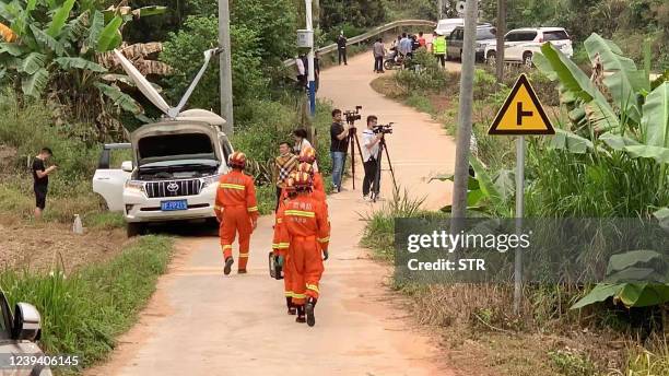 Rescuers head to the site of a plane crash in Tengxian county, Wuzhou city, in China's southern Guangxi region on March 22, 2022. - A China Eastern...