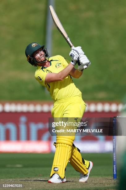 Australia's captain Meg Lanning hits over the boundary line for six runs during the Women's Cricket World Cup match between Australia and South...