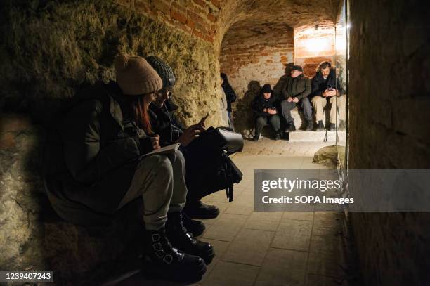 People hide in one of the official underground shelters during an air alarm. Russia invaded Ukraine on 24 February 2022, triggering the most...