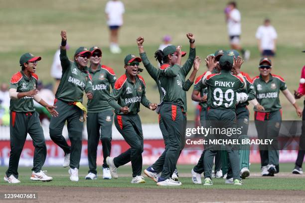 Bangladesh players celebrate the run out of India's Harmanpreet Kaur during the 2022 Women's Cricket World Cup match between India and Bangladesh at...