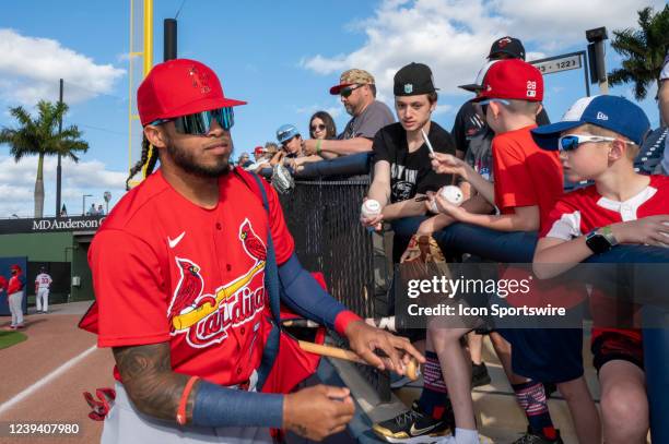St. Louis Cardinals infielder Delvin Perez signs autographs for fans before an MLB spring training game between the St Louis Cardinals and the...
