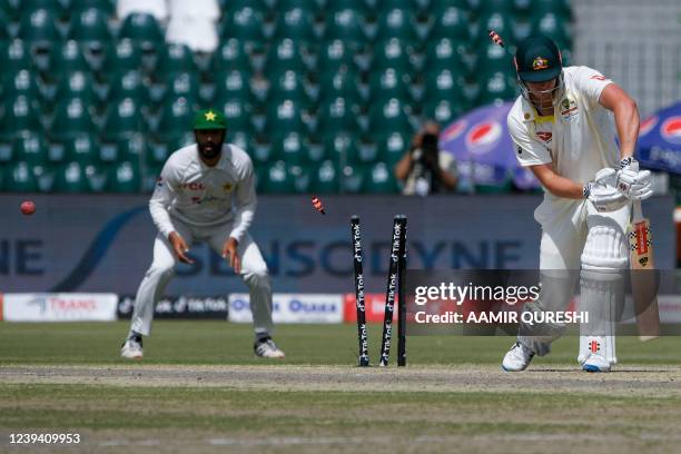 Australia's Cameron Green is bowled out off Pakistan's Naseem Shah during the second day of the third cricket Test match between Pakistan and...