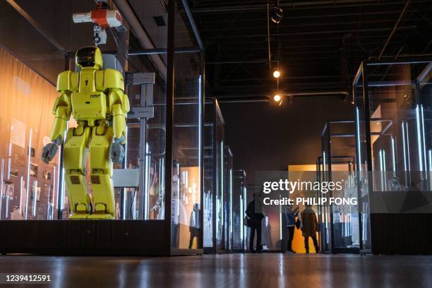 People visit the "You and Robots ? What is it to be Human?" exhibition at the National Museum of Emerging Science and Innovation in Tokyo on March...