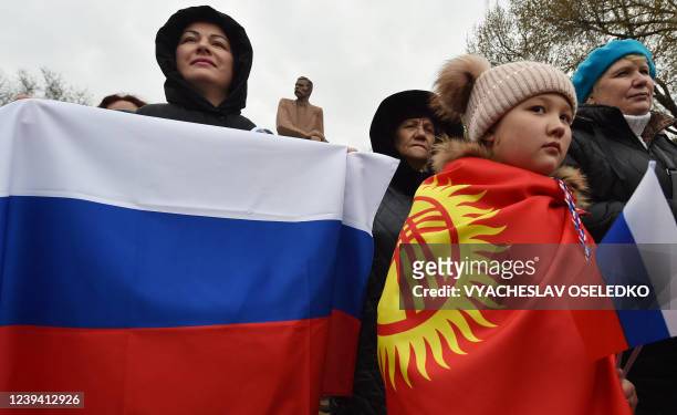 People take part in a rally to support Russian military action in Ukraine, in Bishkek on March 22, 2022.