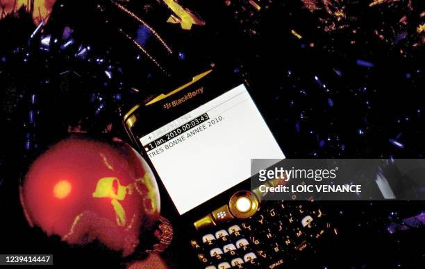 Photo prise le 29 décembre 2009 à Paris d'un SMM de voeux de "bonne année" rédigé sur un blackberry. Près de 500 millions de SMS de "bonne année"...