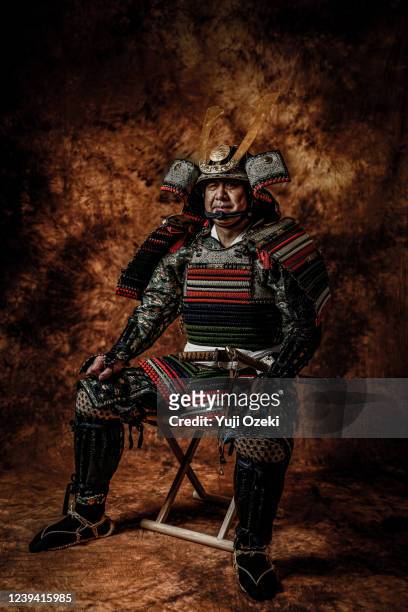 a warrior who has perfect defense with a samurai armor for battle - capacete tradicional imagens e fotografias de stock