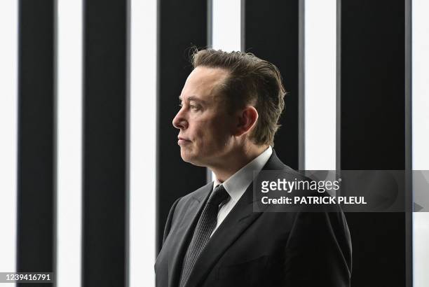 Tesla CEO Elon Musk is pictured as he attends the start of the production at Tesla's "Gigafactory" on March 22, 2022 in Gruenheide, southeast of...