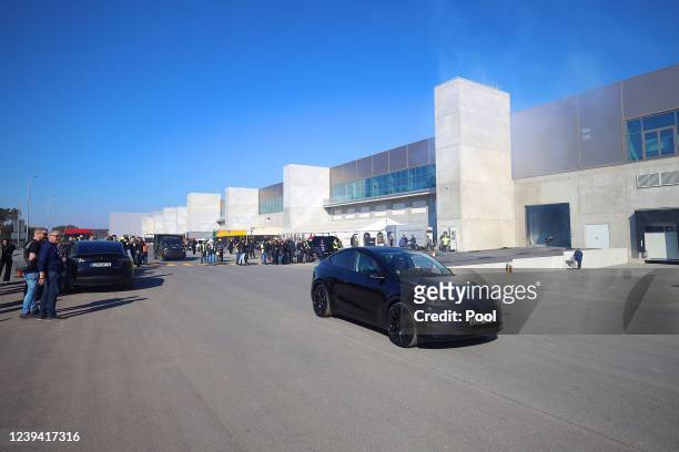 New Tesla car is seen during the official opening of the new Tesla electric car manufacturing plant on March 22, 2022 near Gruenheide, Germany. The...