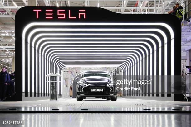 New Tesla car is seen during the official opening of the new Tesla electric car manufacturing plant on March 22, 2022 near Gruenheide, Germany. The...