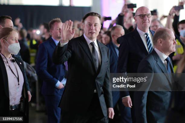 German Chancellor Olaf Scholz , Brandenburg State Premier Dietmar Woidke and Tesla CEO Elon Musk attend the official opening of the new Tesla...