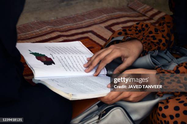 In this photograph taken on March 20 school girl Marwa Ayoubi studies at a home in Kandahar. The reopening of secondary schools for girls across...