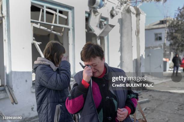 Nurses cry as they arrive to see their hospital after Russian shelling hit the mental hospital of Mykolaiv, southern Ukraine, on March 22, 2022. -...