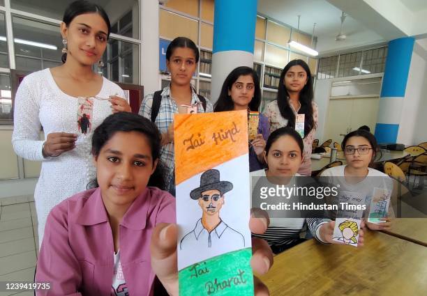Students participate in a poster making competition to commemorate the martyrdom day of Shaheed Bhagat Singh, Sukhdev and Rajguru, organized at...