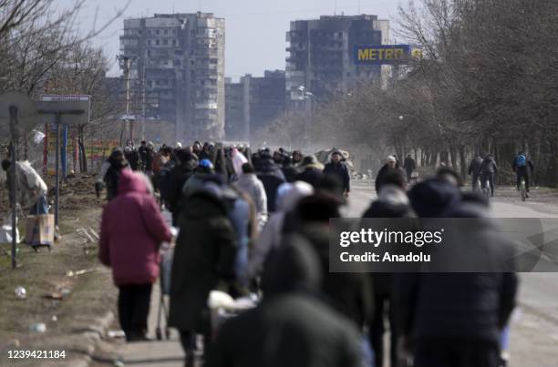 Civilians being evacuated along humanitarian corridors from the Ukrainian city of Mariupol besieged by Russian military and rebel forces, on March...