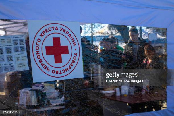 People seek help at a red cross tent. As the war in Ukraine continues people flee from the violence by train coming to Lviv or traveling on to Poland.