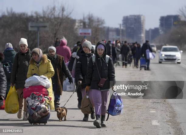 Civilians being evacuated along humanitarian corridors from the Ukrainian city of Mariupol besieged by Russian military and rebel forces, on March...