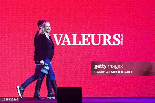 French far-right politician Marion Marechal arrives on stage during a debate organised by French weekly magazine 'Valeurs Actuelles' in Paris, on...