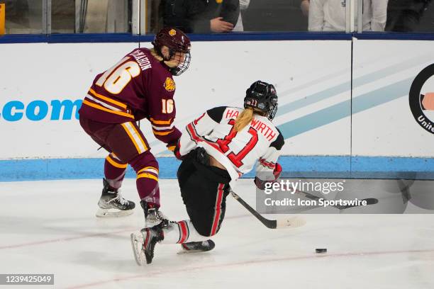 Minnesota Duluth Bulldogs Forward Mannon McMahon and Ohio State Buckeyes Forward Kenzie Hauswirth chase the puck during the first period of the Div I...