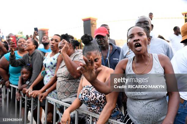 People protest the visit of the Duke and Duchess of Cambridge in Kingston, Jamaica, on March 22, 2022. - Demonstrators gathered March 22 in Kingston,...