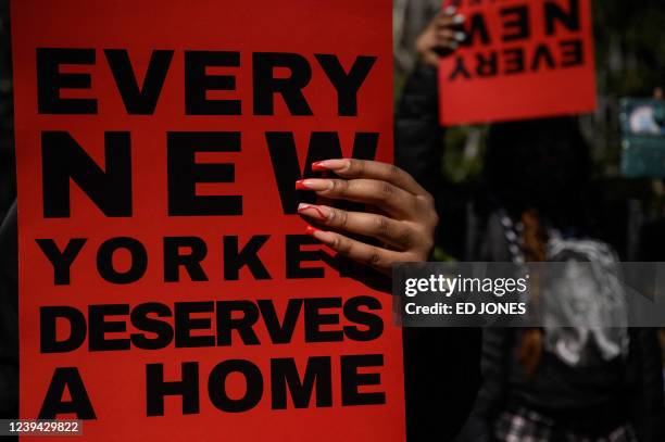 Activists, supporters, and members of the homeless community attend a protest calling for greater access to housing and better conditions at homeless...