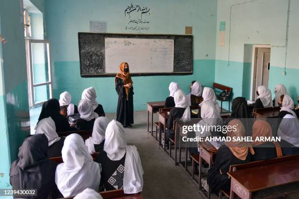 Updated information - Girls attend a class after their school reopened in Kabul on March 23, 2022. - The Taliban ordered girls' secondary schools in...