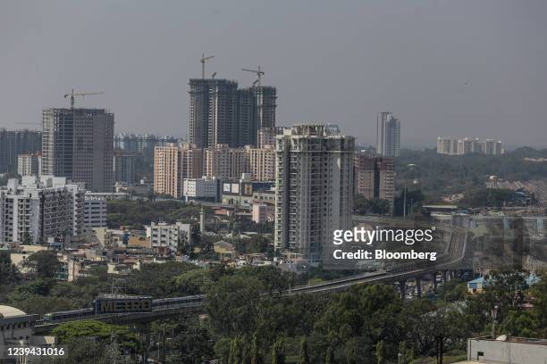 Residential and commercial buildings in Bengaluru, India, on Monday, Feb. 21, 2022. Solar power, which has become the cheapest source of new power,...