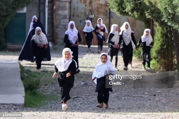 Girls arrive at their school in Panjshir on March 23, 2022. The Taliban ordered girls' secondary schools in Afghanistan to shut on March 23 just...