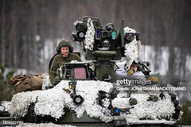 Soldiers from the Norwegian Armed Forces operate a tank as they participate in the international military exercise Cold Response 22, at Setermoen,...