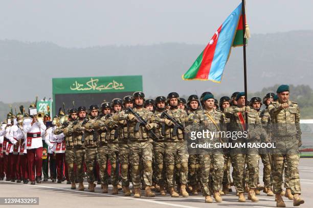 Azerbaijan's soldiers march during the Pakistan Day parade in Islamabad on March 23, 2022.