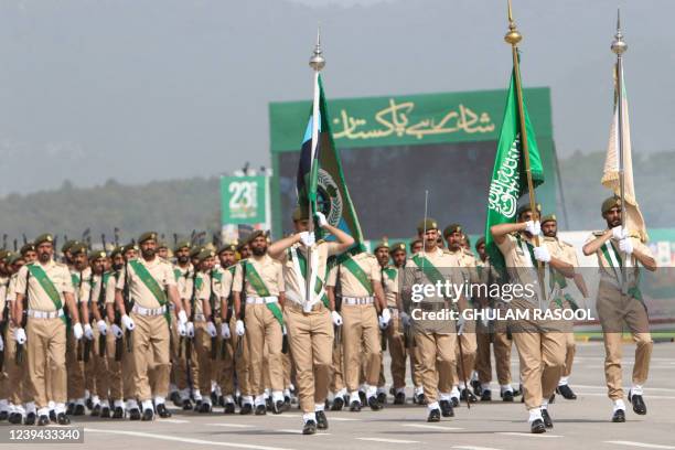 Saudi Arabia's army soldiers march during the Pakistan Day parade in Islamabad on March 23, 2022.