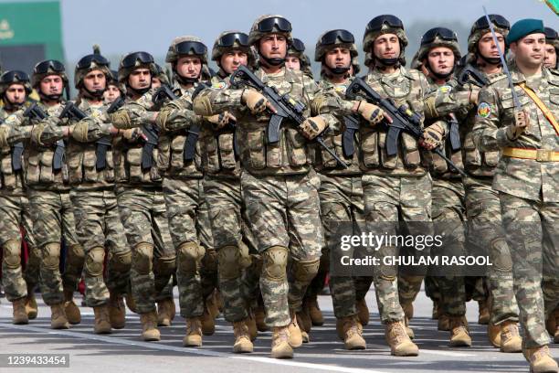 Azerbaijan's army soldiers march during the Pakistan Day parade in Islamabad on March 23, 2022.