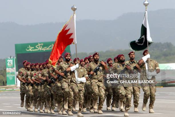 Bahrain's army soldiers march during the Pakistan Day parade in Islamabad on March 23, 2022.