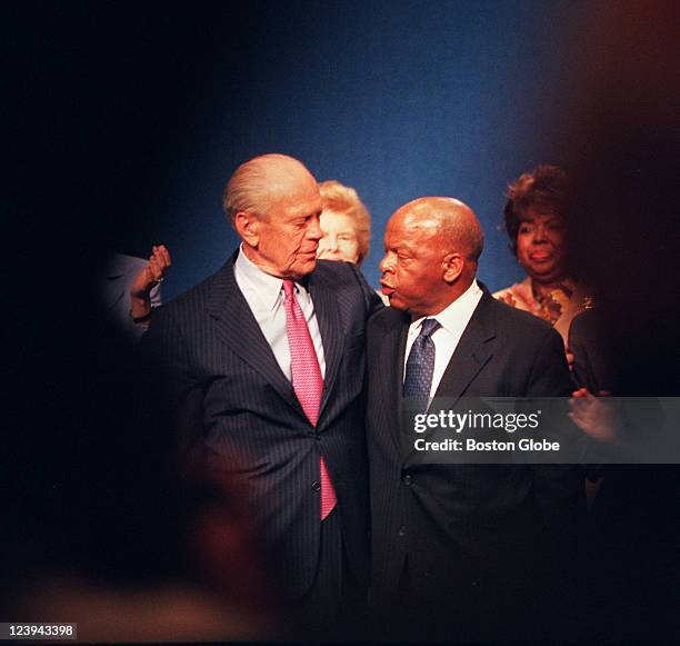 President Gerald Ford, left, and Congressman John Lewis, right, embrace after receiving Profiles in Courage awards at the JFK Library on Monday...