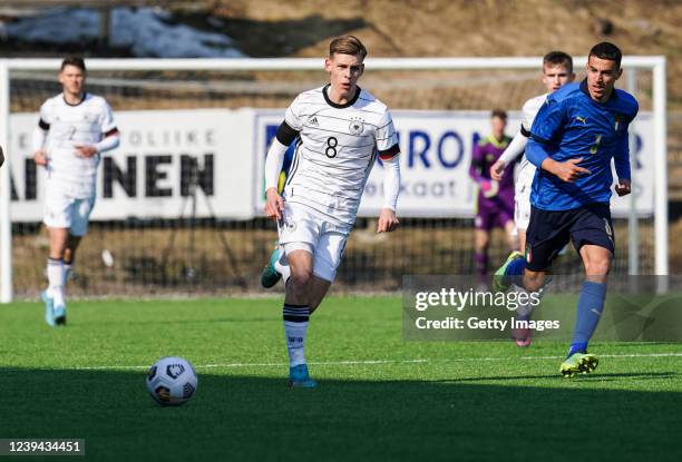 Anton Kande of Germany running with the ball past Riccardo Turricchia of Italy during the UEFA Under19 European Championship Qualifier match between...