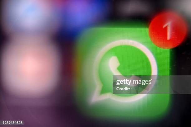 Picture taken on March 23, 2022 in Moscow shows the US instant messaging software Whatsapp logo on a smartphone screen.