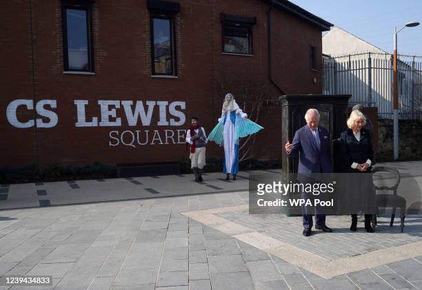 Prince Charles, Prince of Wales and Camilla, Duchess of Cornwall with a statue of CS Lewis and the wardrobe from the Lion the Witch and the Wardrobe...