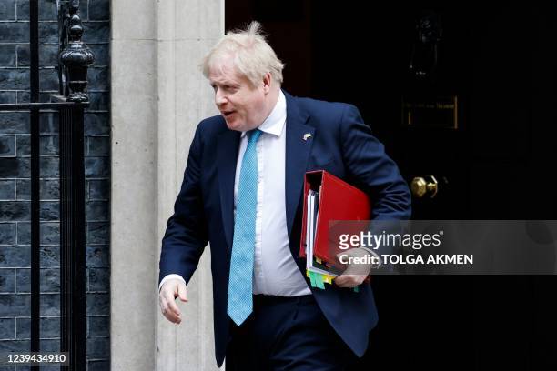 Britain's Prime Minister Boris Johnson leaves after attending the weekly Cabinet meeting at 10 Downing Street, in London, on March 23, 2022 in order...