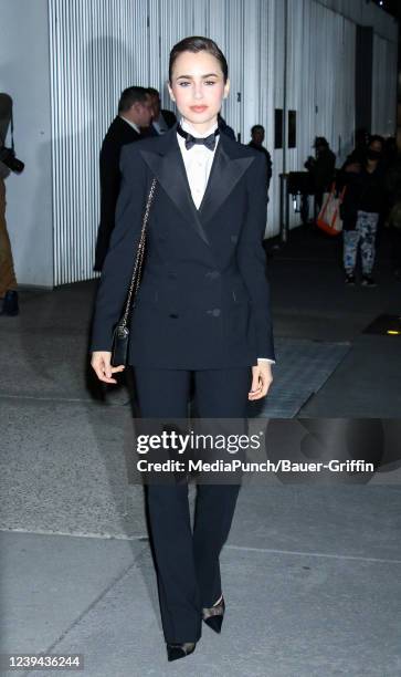 Lily Collins is seen arriving at the Ralph Lauren Spring 2022 Ready-to-Wear Collection at the MOMA on March 22, 2022 in New York City.