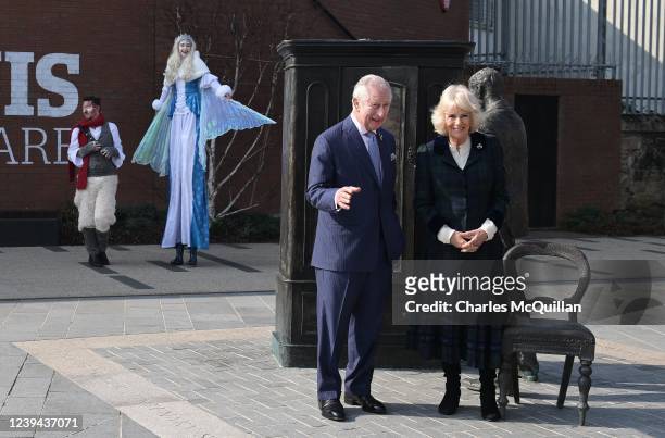 Prince Charles, Prince of Wales and Camilla, Duchess of Cornwall stand beside a statue of C.S. Lewis as they visit C.S. Lewis Square named after the...