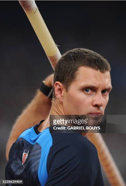 Athlete Brad Walker warms up during the men's Pole vault qualifiers at the National stadium as part of the 2008 Beijing Olympic Games on August 20,...