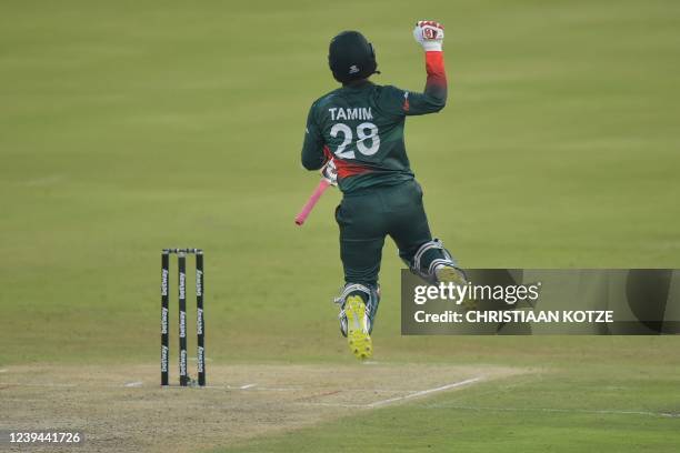 Bangladesh's Tamim Iqbal jumps in the air after Bangladesh won the third one-day international cricket match between South Africa and Bangladesh at...