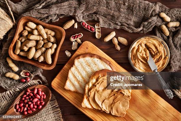 toast with peanut butter on vintage table set in rustic kitchen - sandwich top view stock pictures, royalty-free photos & images